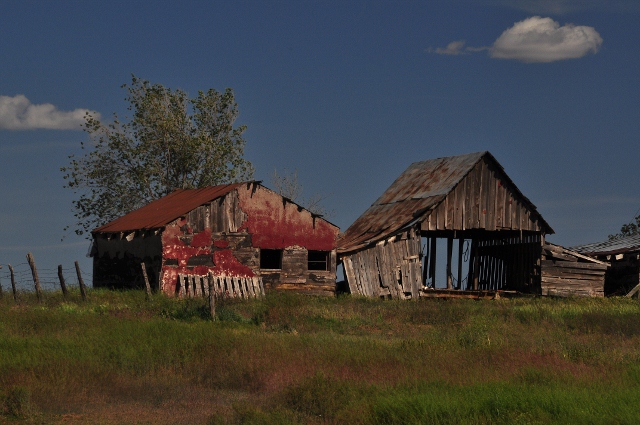 old farm buildings on a hill